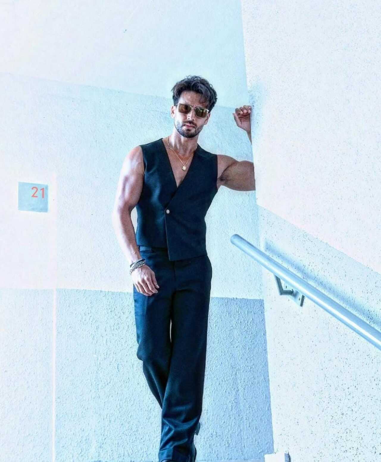 Tiger proves that less is always more in a sharp black sleeveless waistcoat paired with matching tailored trousers.